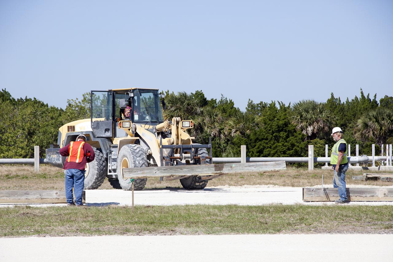 CAPE CANAVERAL, Fla. -- At NASA’s Kennedy Space Center in Florida, workers from Canaveral Construction in Mims, Fla., continue to re-grade the lime rock in sections of the crawlerway leading to Launch Pad 39B.   The crawlerway is being upgraded to improve the foundation and prepare it to support the weight of NASA’s Space Launch System, or SLS, and mobile launcher on the crawler-transporter during rollout. Workers are removing the original Alabama river rock and restoring the layer of lime rock below to its original depth. Then new river rock will be added on top. The Ground Systems Development and Operations, or GSDO, Program office at Kennedy is leading the center’s transformation to safely handle a variety of rockets and spacecraft. For more information about GSDO, visit: http:__go.nasa.gov_groundsystems.  Photo credit: NASA_Jim Grossmann