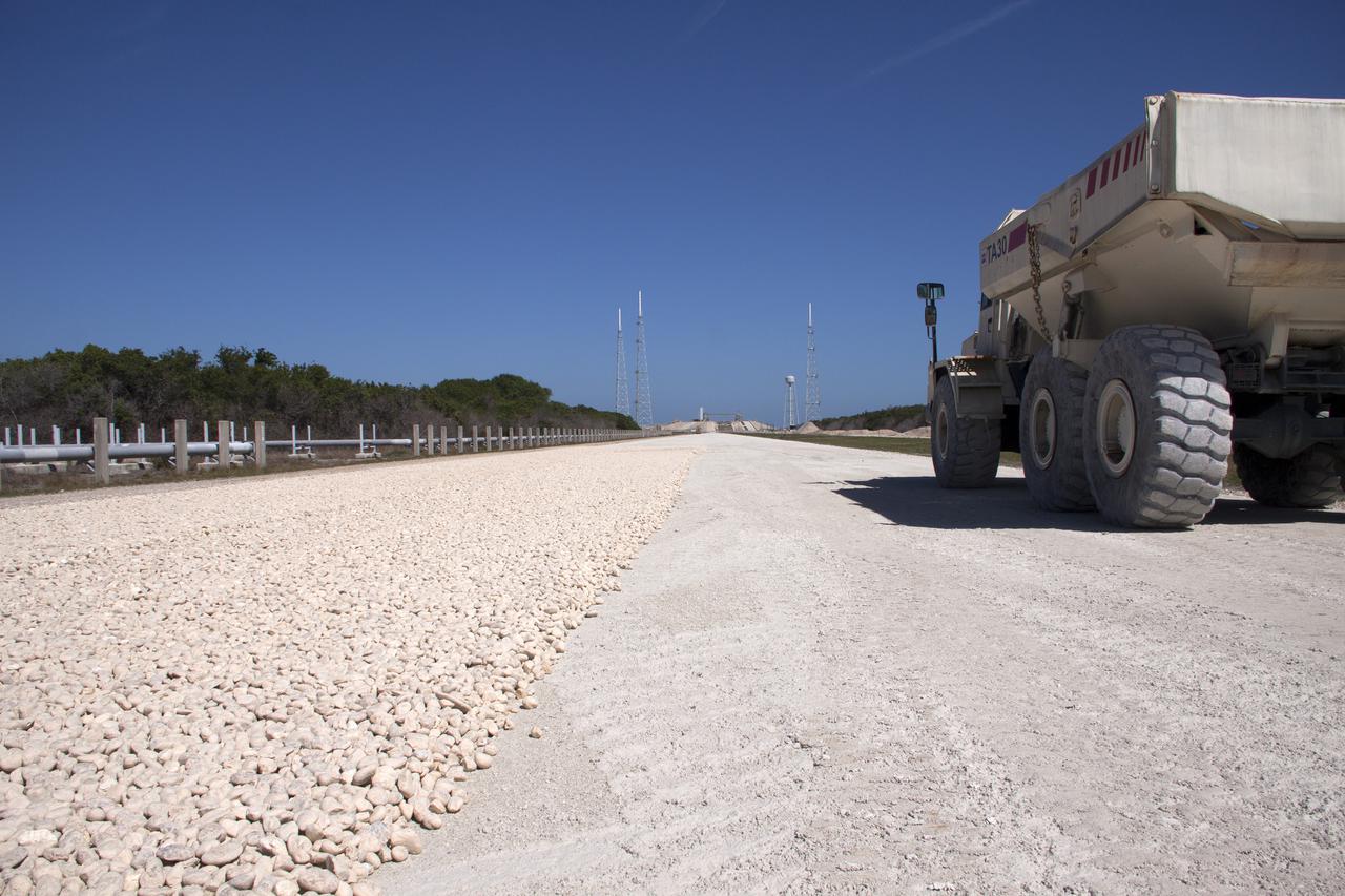 CAPE CANAVERAL, Fla. -- At NASA’s Kennedy Space Center in Florida, workers from Canaveral Construction in Mims, Fla., continue to re-grade the lime rock in sections of the crawlerway leading to Launch Pad 39B.   The crawlerway is being upgraded to improve the foundation and prepare it to support the weight of NASA’s Space Launch System, or SLS, and mobile launcher on the crawler-transporter during rollout. Workers are removing the original Alabama river rock and restoring the layer of lime rock below to its original depth. Then new river rock will be added on top. The Ground Systems Development and Operations, or GSDO, Program office at Kennedy is leading the center’s transformation to safely handle a variety of rockets and spacecraft. For more information about GSDO, visit: http:__go.nasa.gov_groundsystems.  Photo credit: NASA_Jim Grossmann
