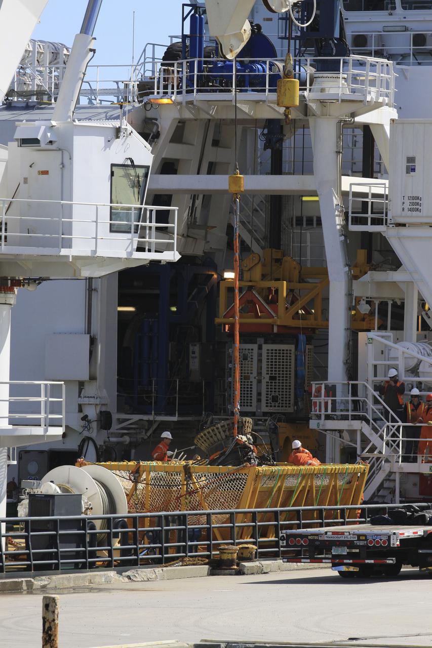 CAPE CANAVERAL, Fla. – Components for two of the F-1 engines that powered the first stage of the Saturn V rockets that lifted NASA's Apollo missions to the moon were recovered from the Atlantic Ocean March 21 by Jeff Bezos, the founder and Chief Executive Officer of the aerospace company Blue Origin and Amazon.com and arrived at Port Canaveral March 22. The engines will be restored by Bezos' team for public display. The engines were found some 14,000 feet underwater where they came to rest more than 40 years ago after sending astronauts into space on missions to the moon. Restoration may reveal exactly which engines were recovered, but Bezos said in a statement that the serial numbers were not immediately visible. Photo credit: NASA_Kim Shiflett