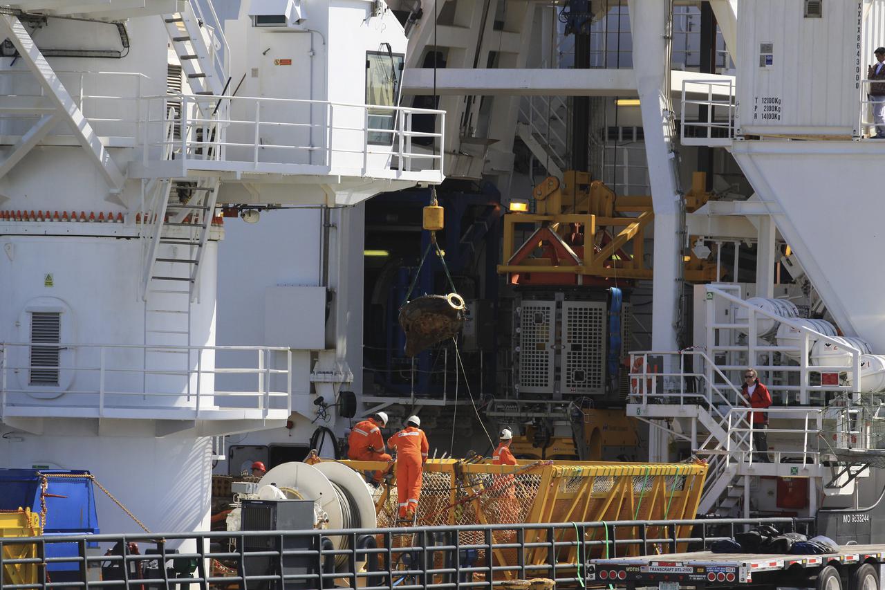CAPE CANAVERAL, Fla. – Components for two of the F-1 engines that powered the first stage of the Saturn V rockets that lifted NASA's Apollo missions to the moon were recovered from the Atlantic Ocean March 21 by Jeff Bezos, the founder and Chief Executive Officer of the aerospace company Blue Origin and Amazon.com and arrived at Port Canaveral March 22. The engines will be restored by Bezos' team for public display. The engines were found some 14,000 feet underwater where they came to rest more than 40 years ago after sending astronauts into space on missions to the moon. Restoration may reveal exactly which engines were recovered, but Bezos said in a statement that the serial numbers were not immediately visible. Photo credit: NASA_Kim Shiflett