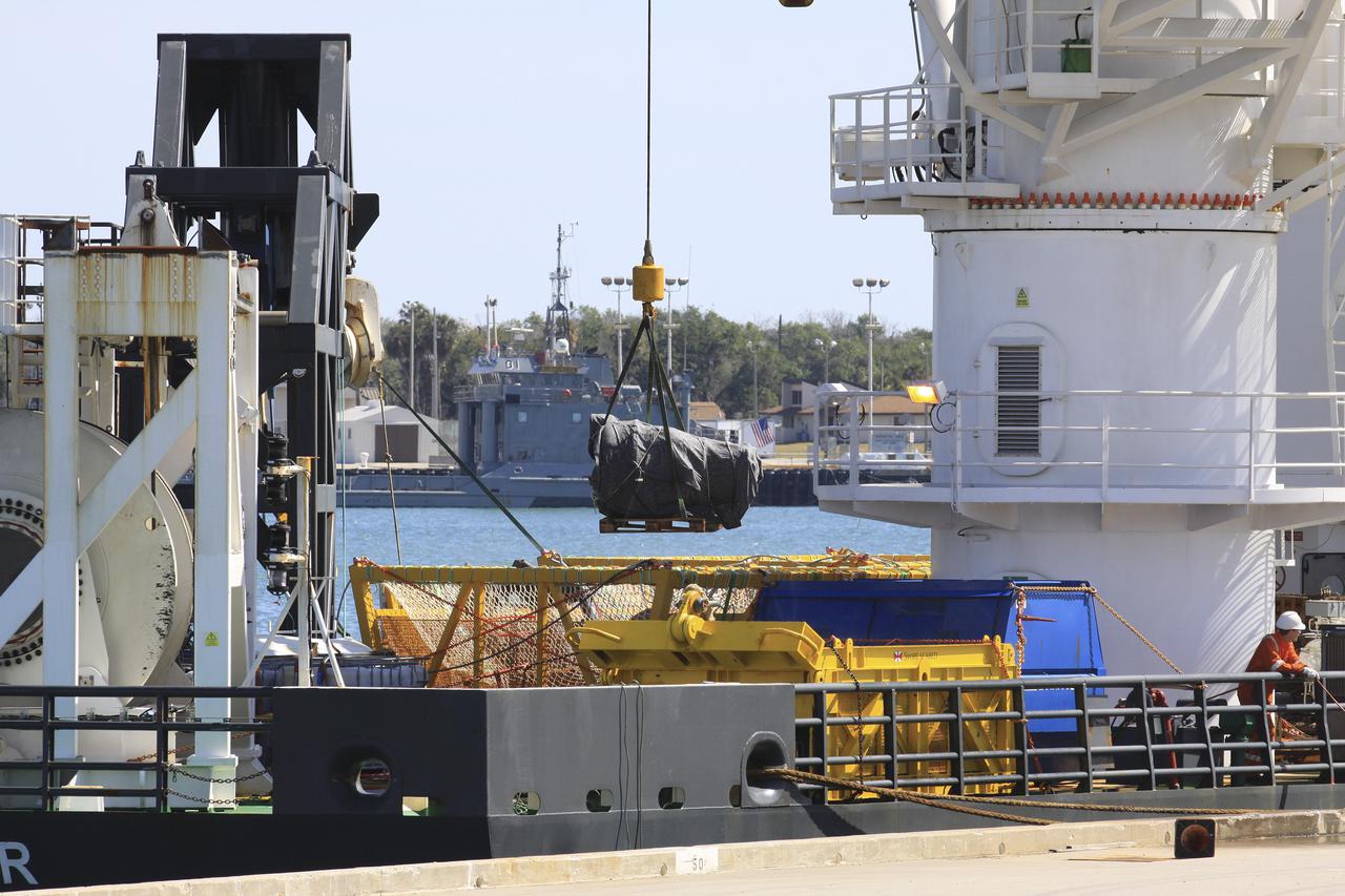 CAPE CANAVERAL, Fla. – Components for two of the F-1 engines that powered the first stage of the Saturn V rockets that lifted NASA's Apollo missions to the moon were recovered from the Atlantic Ocean March 21 by Jeff Bezos, the founder and Chief Executive Officer of the aerospace company Blue Origin and Amazon.com and arrived at Port Canaveral March 22. The engines will be restored by Bezos' team for public display. The engines were found some 14,000 feet underwater where they came to rest more than 40 years ago after sending astronauts into space on missions to the moon. Restoration may reveal exactly which engines were recovered, but Bezos said in a statement that the serial numbers were not immediately visible. Photo credit: NASA_Kim Shiflett