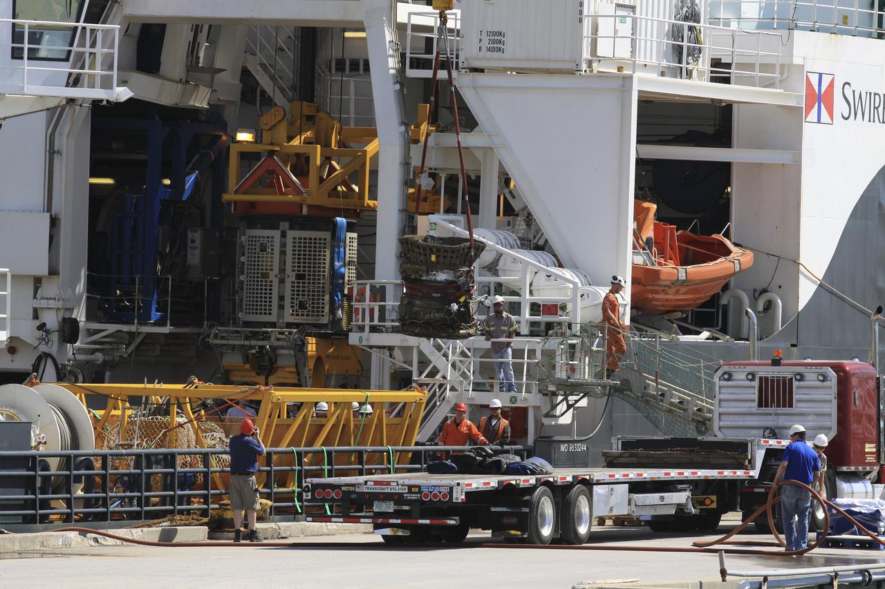 CAPE CANAVERAL, Fla. – Components for two of the F-1 engines that powered the first stage of the Saturn V rockets that lifted NASA's Apollo missions to the moon were recovered from the Atlantic Ocean March 21 by Jeff Bezos, the founder and Chief Executive Officer of the aerospace company Blue Origin and Amazon.com and arrived at Port Canaveral March 22. The engines will be restored by Bezos' team for public display. The engines were found some 14,000 feet underwater where they came to rest more than 40 years ago after sending astronauts into space on missions to the moon. Restoration may reveal exactly which engines were recovered, but Bezos said in a statement that the serial numbers were not immediately visible. Photo credit: NASA_Kim Shiflett