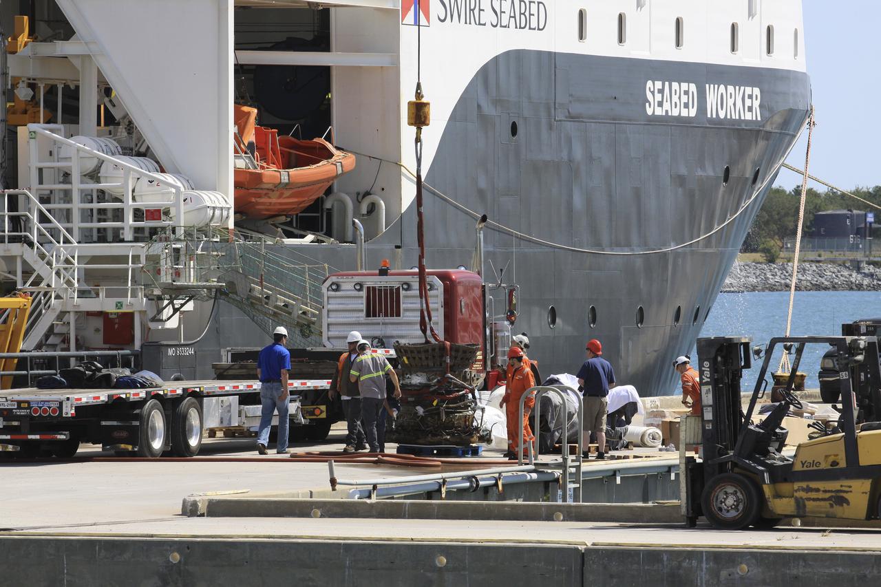 CAPE CANAVERAL, Fla. – Components for two of the F-1 engines that powered the first stage of the Saturn V rockets that lifted NASA's Apollo missions to the moon were recovered from the Atlantic Ocean March 21 by Jeff Bezos, the founder and Chief Executive Officer of the aerospace company Blue Origin and Amazon.com and arrived at Port Canaveral March 22. The engines will be restored by Bezos' team for public display. The engines were found some 14,000 feet underwater where they came to rest more than 40 years ago after sending astronauts into space on missions to the moon. Restoration may reveal exactly which engines were recovered, but Bezos said in a statement that the serial numbers were not immediately visible. Photo credit: NASA_Kim Shiflett