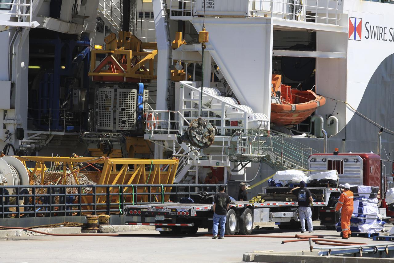 CAPE CANAVERAL, Fla. – Components for two of the F-1 engines that powered the first stage of the Saturn V rockets that lifted NASA's Apollo missions to the moon were recovered from the Atlantic Ocean March 21 by Jeff Bezos, the founder and Chief Executive Officer of the aerospace company Blue Origin and Amazon.com and arrived at Port Canaveral March 22. The engines will be restored by Bezos' team for public display. The engines were found some 14,000 feet underwater where they came to rest more than 40 years ago after sending astronauts into space on missions to the moon. Restoration may reveal exactly which engines were recovered, but Bezos said in a statement that the serial numbers were not immediately visible. Photo credit: NASA_Kim Shiflett