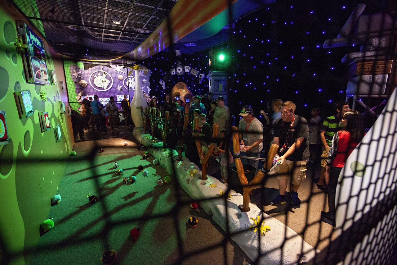 CAPE CANAVERAL, Fla. -- At NASA’s Kennedy Space Center Visitor Complex in Florida, visitors try out some of the interactive exhibits inside the Angry Birds Space Encounter after the grand opening ceremony for the new attraction.     Finland-based Rovio Entertainment, the creator of the Angry Birds Space game, partnered with Kennedy Space Center to bring the beloved characters to life. It is the first Angry Birds interactive exhibit in the United States designed for people of all ages. The 4,485-square-foot facility hosts the space adventures of the Angry Birds as they travel into an intergalactic wormhole, come face-to-face with Space Pigs and discover heroic superpowers. Six interactive stations are designed to encourage children in science, technology, engineering and mathematics fields of study. Photo credit: NASA_Kim Shiflett