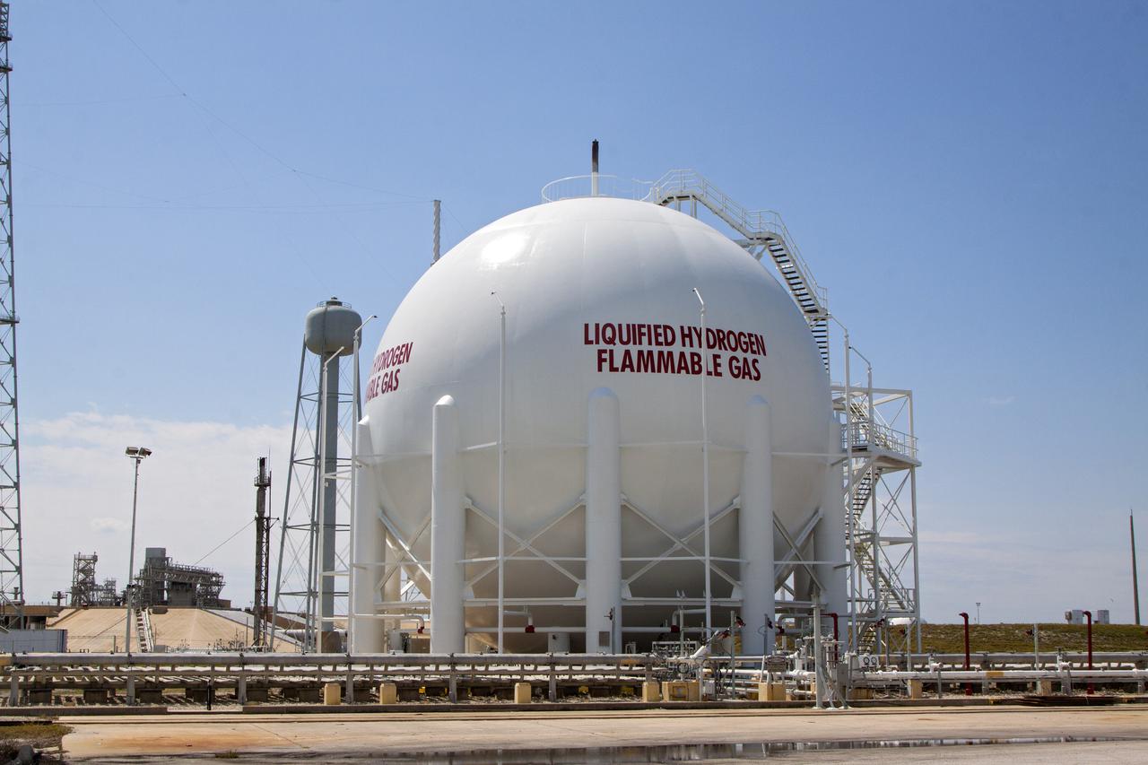 CAPE CANAVERAL, Fla. – At Launch Pad 39B at NASA’s Kennedy Space Center in Florida, the liquid oxygen, or LOX, and liquid hydrogen, or LH2, tanks that supported space shuttle launches for 30 years have been sandblasted, repaired and repainted.  The two tanks, designed to store super-cooled LOX and LH2, were refurbished to prepare them to support the launch of NASA’s Space Launch System and other launch vehicles. The Ground Systems Development and Operations, or GSDO, Program office at Kennedy is leading the center’s transformation to safely handle a variety of rockets and spacecraft. For more information about GSDO, visit: http:__go.nasa.gov_groundsystems.  Photo credit: NASA_Kim Shiflett