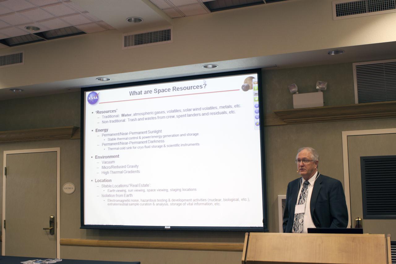 CAPE CANAVERAL, Fla. – At the Courtyard by Marriott hotel in Cocoa Beach, Fla., William Larson, retired NASA ISRU project manager, talks to participants in the room and those participating online during the Third International Workshop on Lunar Superconductor Applications. The workshop included presentations from several engineers and researchers at Kennedy Space Center.  The three-day workshop included presentations from speakers throughout the country and focused on Lunar in-situ resource utilization, NASA’s Lunar Ice Prospector called RESOLVE, CubeSats, cryogenic storage and many other topics related to lunar exploration. Photo credit: NASA_Jim Grossmann