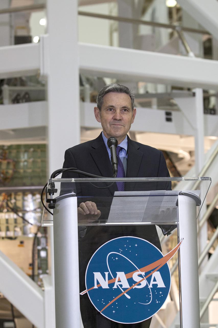 CAPE CANAVERAL, Fla. – In the Operations and Checkout Building OandC at the Kennedy Space Center in Florida, Kennedy Director Bob Cabana speaks to news media representatives updating progress on preparing the Orion spacecraft for its first uncrewed mission, Exploration Flight Test-1 EFT-1 in 2014. Launched atop NASA's heavy-lift Space Launch System rocket, Orion is now targeted to take astronauts in a sample return mission to an asteroid as early as 2021. On the third anniversary of President Barack Obama issuing his challenge to NASA to send astronauts to an asteroid, news media representatives were given an opportunity to see up-close the Orion spacecraft which could take astronauts on such a flight. They also heard from key leaders of that effort in Kennedy's OandC where Orion's assembly is taking place. Photo credit: NASA_Kim Shiflett