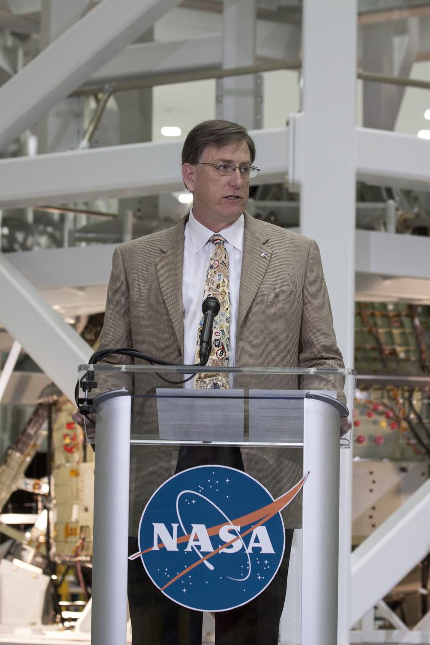 CAPE CANAVERAL, Fla. – In the Operations and Checkout Building OandC at the Kennedy Space Center in Florida, Dan Dumbacher, NASA's deputy associate administrator for Exploration Systems Development, speaks to news media representatives updating progress on preparing the Orion spacecraft for its first uncrewed mission, Exploration Flight Test-1 EFT-1 in 2014. Launched atop NASA's heavy-lift Space Launch System rocket, Orion is now targeted to take astronauts in a sample return mission to an asteroid as early as 2021. On the third anniversary of President Barack Obama issuing his challenge to NASA to send astronauts to an asteroid, news media representatives were given an opportunity to see up-close the Orion spacecraft which could take astronauts on such a flight. They also heard from key leaders of that effort in Kennedy's OandC where Orion's assembly is taking place. Photo credit: NASA_Kim Shiflett