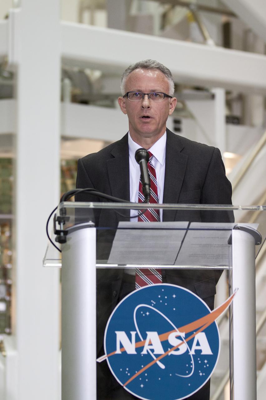 CAPE CANAVERAL, Fla. – In the Operations and Checkout Building OandC at the Kennedy Space Center in Florida, Keith Hefner, NASA's Space Launch System program planning and control manager, speaks to news media representatives updating progress on preparing the Orion spacecraft for its first uncrewed mission, Exploration Flight Test-1 EFT-1 in 2014. Launched atop NASA's heavy-lift Space Launch System rocket, Orion is now targeted to take astronauts in a sample return mission to an asteroid as early as 2021. On the third anniversary of President Barack Obama issuing his challenge to NASA to send astronauts to an asteroid, news media representatives were given an opportunity to see up-close the Orion spacecraft which could take astronauts on such a flight. They also heard from key leaders of that effort in Kennedy's OandC where Orion's assembly is taking place. Photo credit: NASA_Kim Shiflett