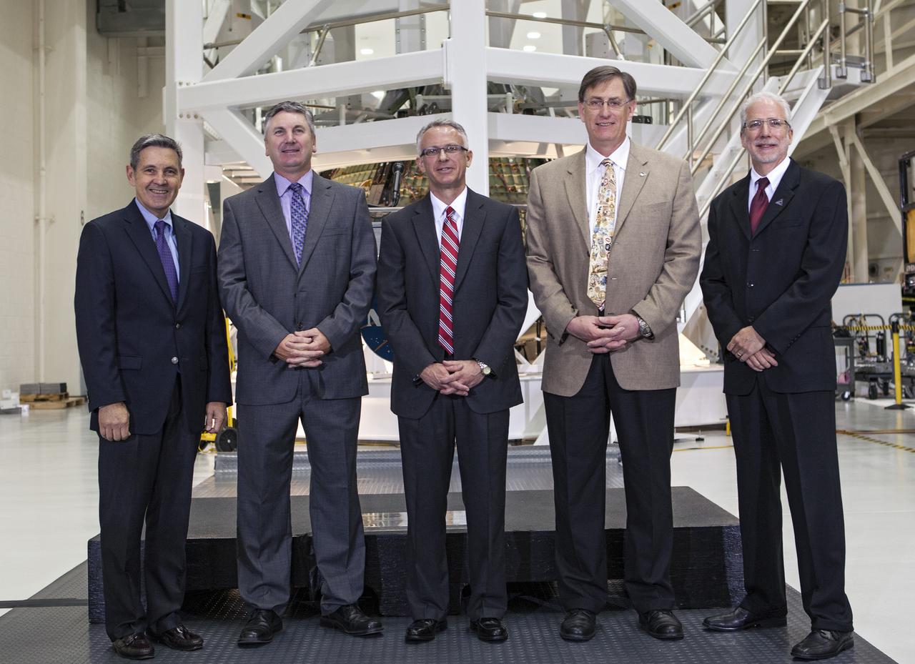 CAPE CANAVERAL, Fla. – In the Operations and Checkout Building OandC at the Kennedy Space Center in Florida, news media representatives were updated progress on preparing the Orion spacecraft for its first uncrewed mission, Exploration Flight Test-1 EFT-1 in 2014. Speakers included, from left, Kennedy Director Bob Cabana Scott Colloredo, chief architect for the Ground Systems Development and Operations Program Keith Hefner, NASA's Space Launch System program planning and control manager Dan Dumbacher, NASA's deputy associate administrator for Exploration Systems Development and Mark Geyer, NASA's Orion program manager. Launched atop NASA's heavy-lift Space Launch System rocket, Orion is now targeted to take astronauts in a sample return mission to an asteroid as early as 2021. On the third anniversary of President Barack Obama issuing his challenge to NASA to send astronauts to an asteroid, news media representatives were given an opportunity to see up-close the Orion spacecraft which could take astronauts on such a flight. They also heard from key leaders of that effort in Kennedy's OandC where Orion's assembly is taking place. Photo credit: NASA_Kim Shiflett