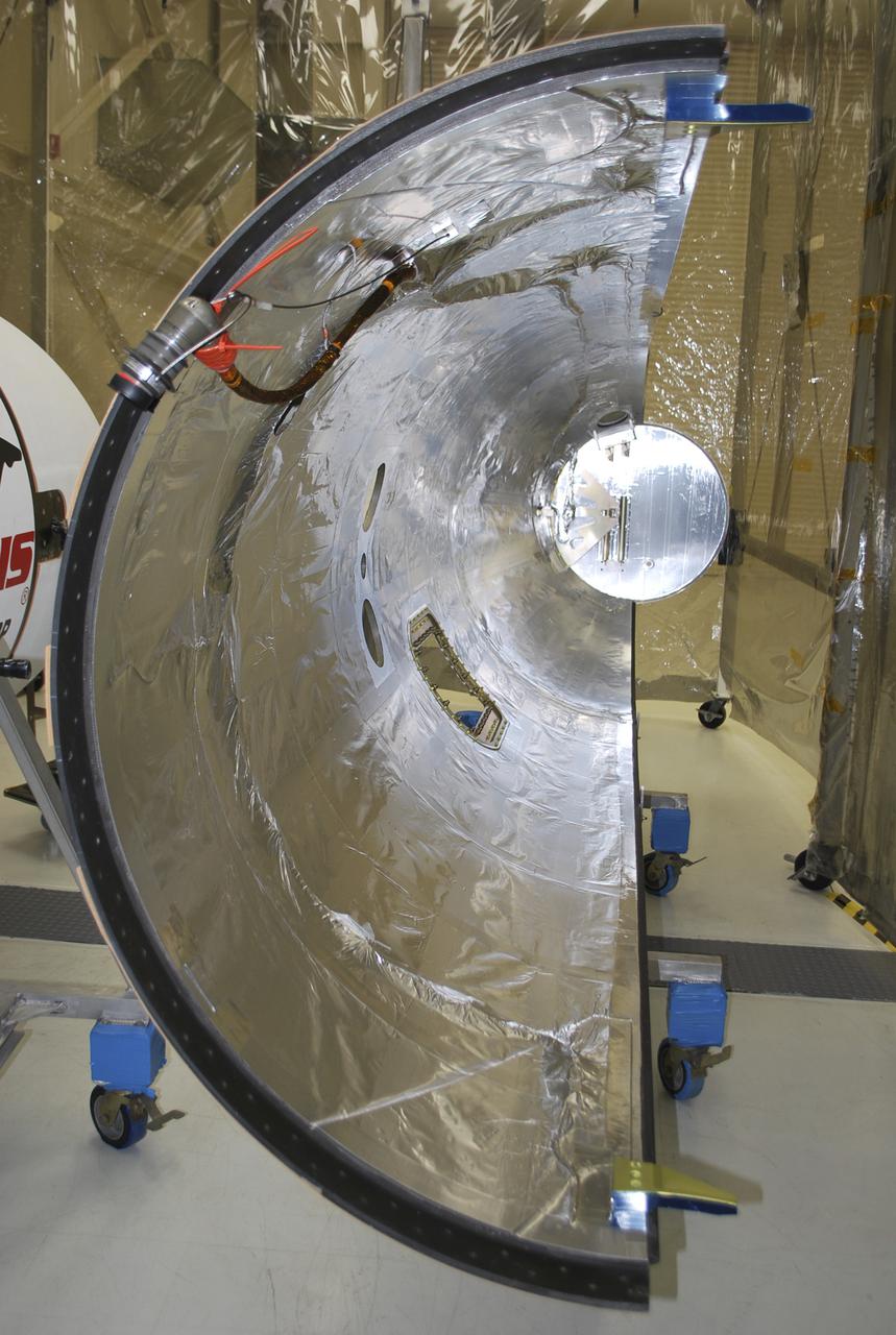 VANDENBERG AFB, Calif. – Half of the payload fairing that will protect NASA's IRIS spacecraft during launch aboard an Orbital Sciences Pegasus XL rocket as it is readied for launch. NASA’s Interface Region Imaging Spectrograph, or IRIS, satellite will improve our understanding of how heat and energy move through the deepest levels of the sun’s atmosphere, thereby increasing our ability to forecast space weather. On launch day, deployment of the Pegasus from Orbital’s L-1011 carrier aircraft will occur at a location over the Pacific Ocean about 100 miles northwest of Vandenberg off the central coast of California south of Big Sur.Photo credit: VAFB_Randy Beaudoin
