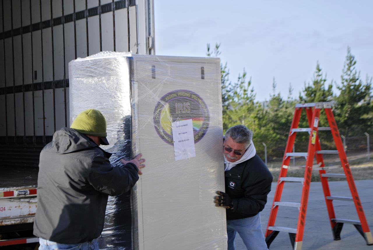 VANDENBERG AFB, Calif. – Technicians offload ground support equipment slated for NASA's IRIS mission. NASA’s Interface Region Imaging Spectrograph, or IRIS, satellite will improve our understanding of how heat and energy move through the deepest levels of the sun’s atmosphere, thereby increasing our ability to forecast space weather. On launch day, deployment of the Pegasus from Orbital’s L-1011 carrier aircraft will occur at a location over the Pacific Ocean about 100 miles northwest of Vandenberg off the central coast of California south of Big Sur. Photo credit: VAFB_Randy Beaudoin