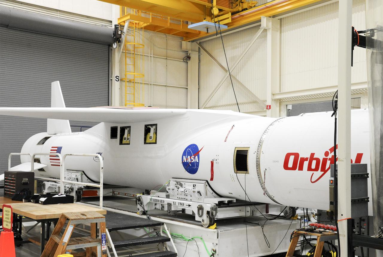 VANDENBERG AFB, Calif. – An Orbital Sciences Pegasus XL rocket that will carry NASA's IRIS spacecraft is positioned for processing at Vandenberg. IRIS is short for Interface Region Imaging Spectrograph and the spacecraft's mission will improve our understanding of how heat and energy move through the deepest levels of the sun’s atmosphere, thereby increasing our ability to forecast space weather. Photo credit: VAFB_Tony Vauelin