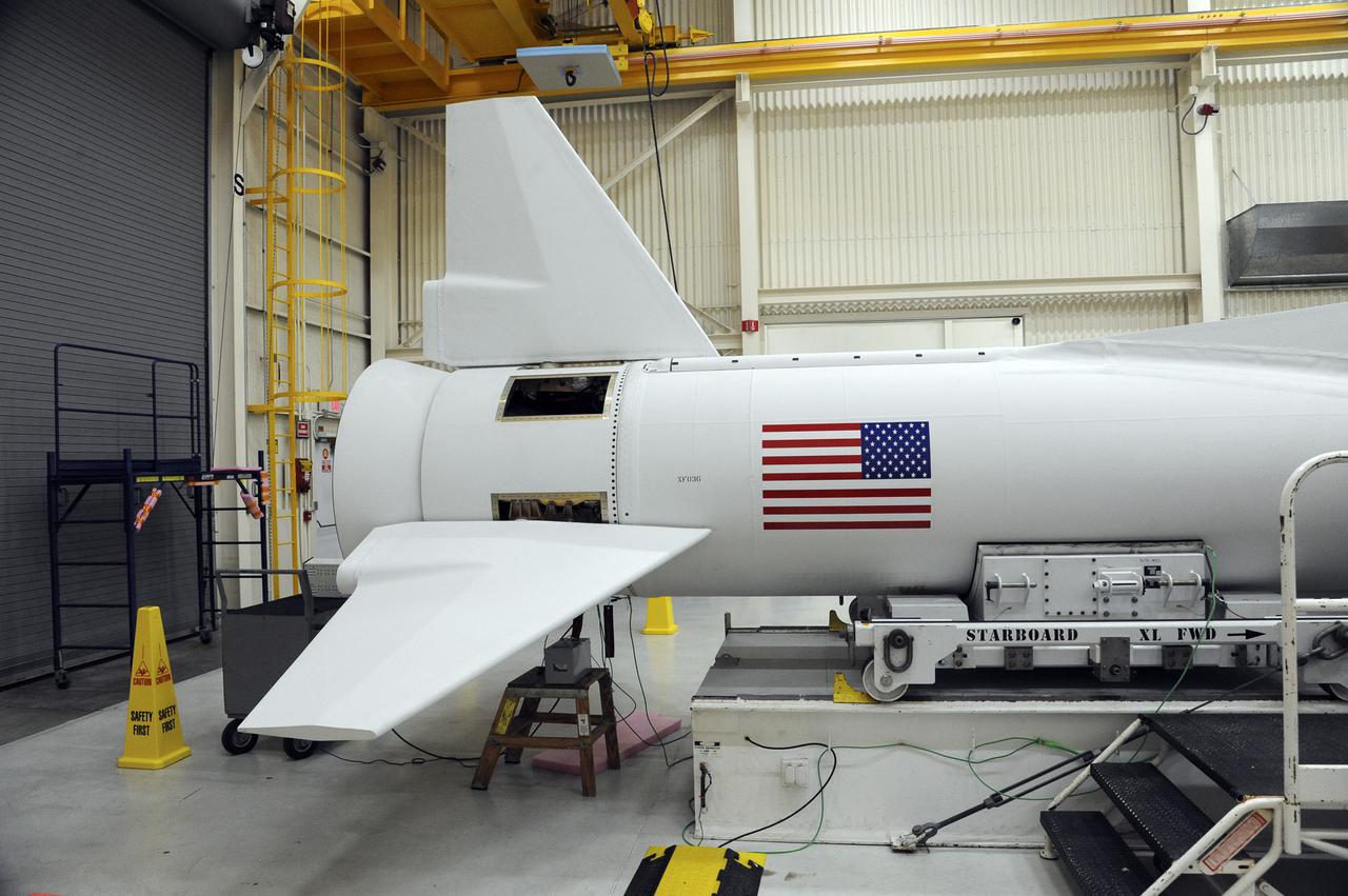 VANDENBERG AFB, Calif. – An Orbital Sciences Pegasus XL rocket that will carry NASA's IRIS spacecraft is positioned for processing at Vandenberg. IRIS is short for Interface Region Imaging Spectrograph and the spacecraft's mission will improve our understanding of how heat and energy move through the deepest levels of the sun’s atmosphere, thereby increasing our ability to forecast space weather. Photo credit: VAFB_Tony Vauelin