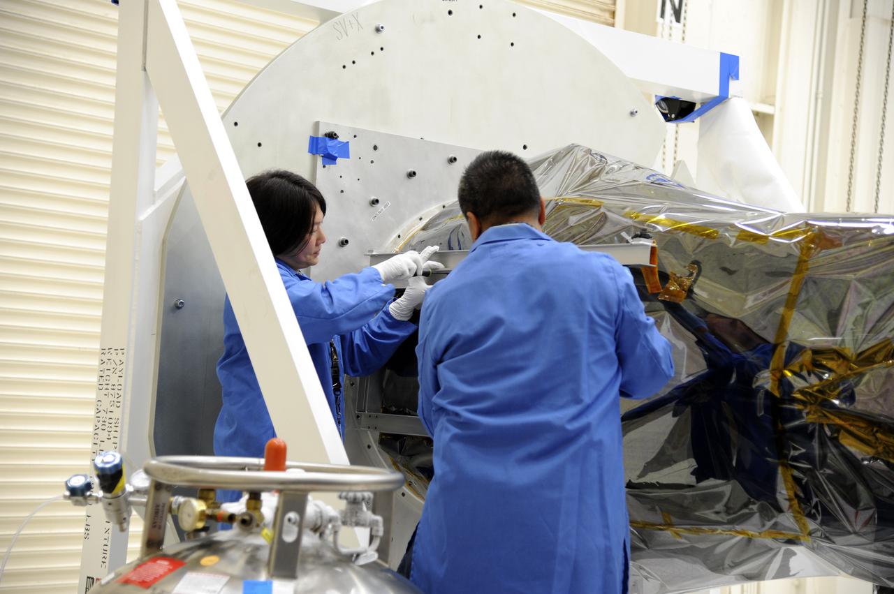 VANDENBERG AFB, Calif. – Technicians begin processing NASA's IRIS spacecraft at Vandenberg where the spacecraft will be readied for launch aboard an Orbital Sciences Pegasus XL rocket. IRIS is short for Interface Region Imaging Spectrograph and the spacecraft's mission will improve our understanding of how heat and energy move through the deepest levels of the sun’s atmosphere, thereby increasing our ability to forecast space weather. Photo credit: VAFB_Doug Gruber