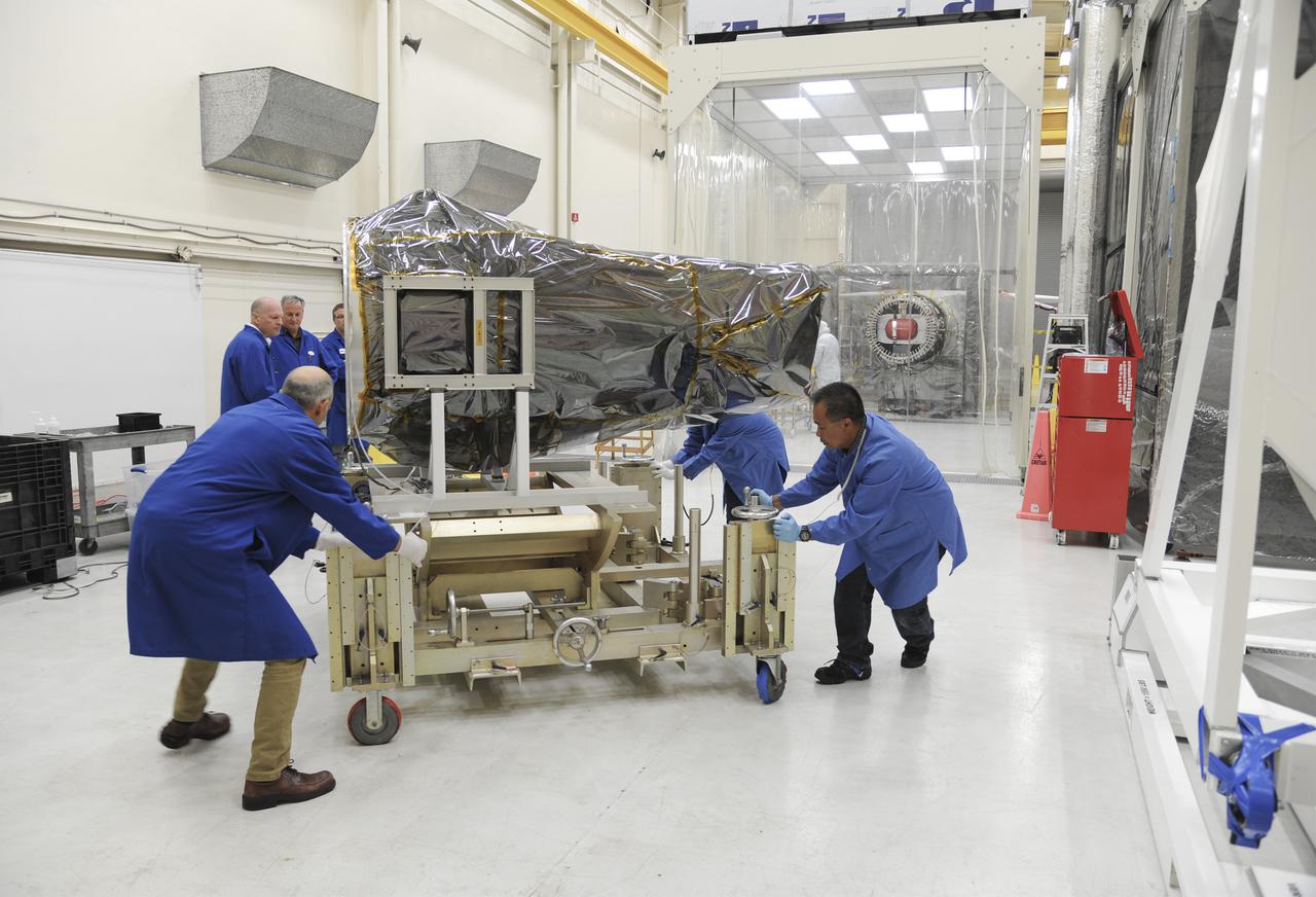 VANDENBERG AFB, Calif. – Technicians move NASA's IRIS spacecraft at Vandenberg where the spacecraft will be readied for launch aboard an Orbital Sciences Pegasus XL rocket. IRIS is short for Interface Region Imaging Spectrograph and the spacecraft's mission will improve our understanding of how heat and energy move through the deepest levels of the sun’s atmosphere, thereby increasing our ability to forecast space weather. Photo credit: VAFB_Doug Gruber