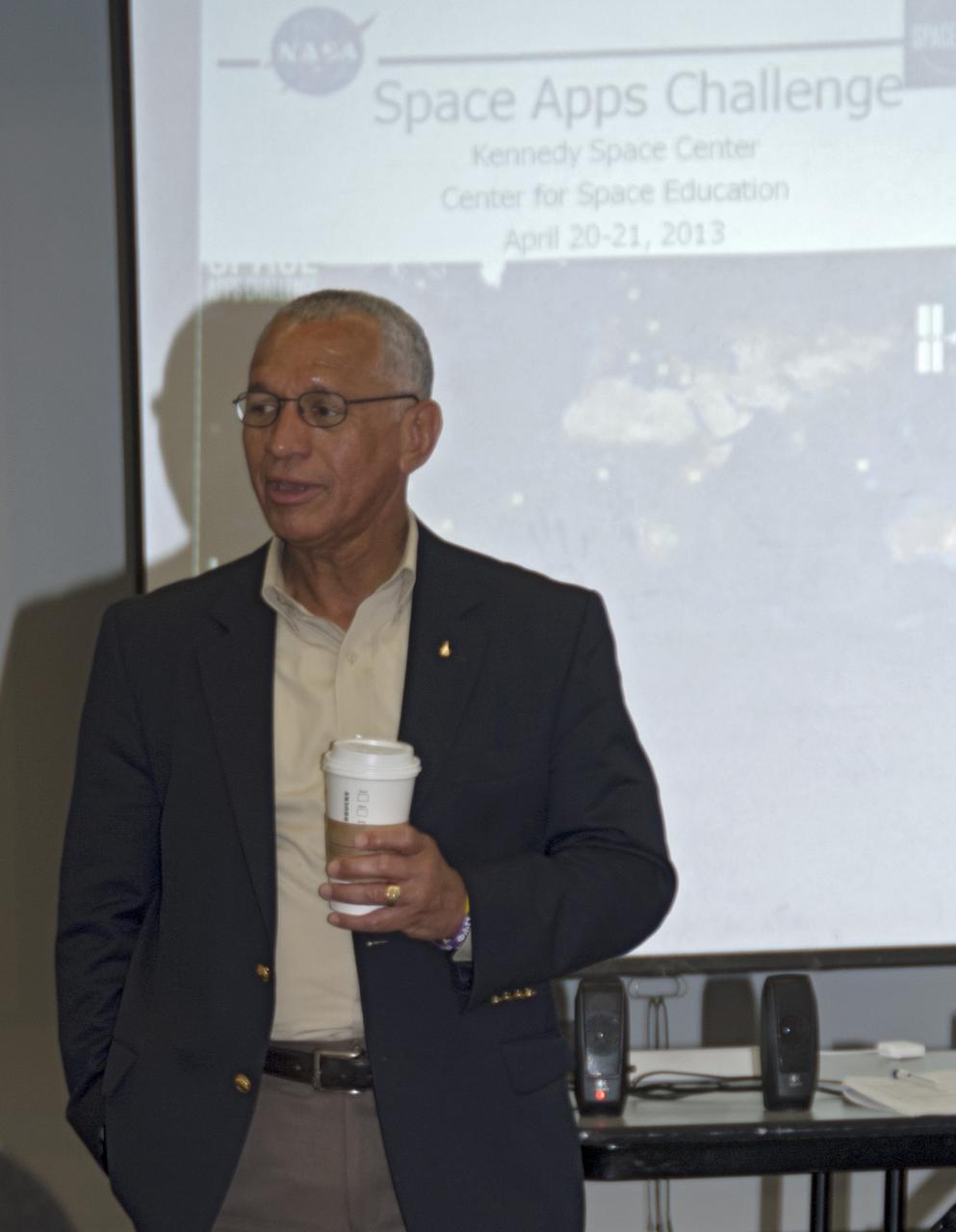 CAPE CANAVERAL, Fla. – NASA Administrator Charlie Bolden speaks with participants of the 2013 International Space Apps Challenge, or ISAC, at The Astronaut Memorial Foundation’s Center for Space Education in Florida during a networking event. During the worldwide two-day challenge, more than 9,000 people and 484 organizations came together in 83 cities across 44 countries, as well as online, to develop new ways of solving challenges that NASA faces. At Kennedy, four teams brainstormed ideas with subject matter experts and others and worked nearly 32 hours straight to present their concepts to a panel of three technical and non-technical judges. Challenges tackled at Kennedy were: Deployable Greenhouse, Kennedy Space Center 2040, Seven Minutes of Science, and Moonville – Lunar Industry Game. Photo credit: NASA_Charisse Nahser