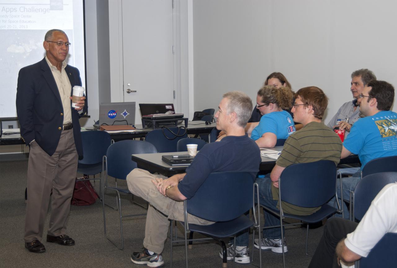 CAPE CANAVERAL, Fla. – NASA Administrator Charlie Bolden speaks with participants of the 2013 International Space Apps Challenge, or ISAC, at The Astronaut Memorial Foundation’s Center for Space Education in Florida during a networking event. During the worldwide two-day challenge, more than 9,000 people and 484 organizations came together in 83 cities across 44 countries, as well as online, to develop new ways of solving challenges that NASA faces. At Kennedy, four teams brainstormed ideas with subject matter experts and others and worked nearly 32 hours straight to present their concepts to a panel of three technical and non-technical judges. Challenges tackled at Kennedy were: Deployable Greenhouse, Kennedy Space Center 2040, Seven Minutes of Science, and Moonville – Lunar Industry Game. Photo credit: NASA_Charisse Nahser