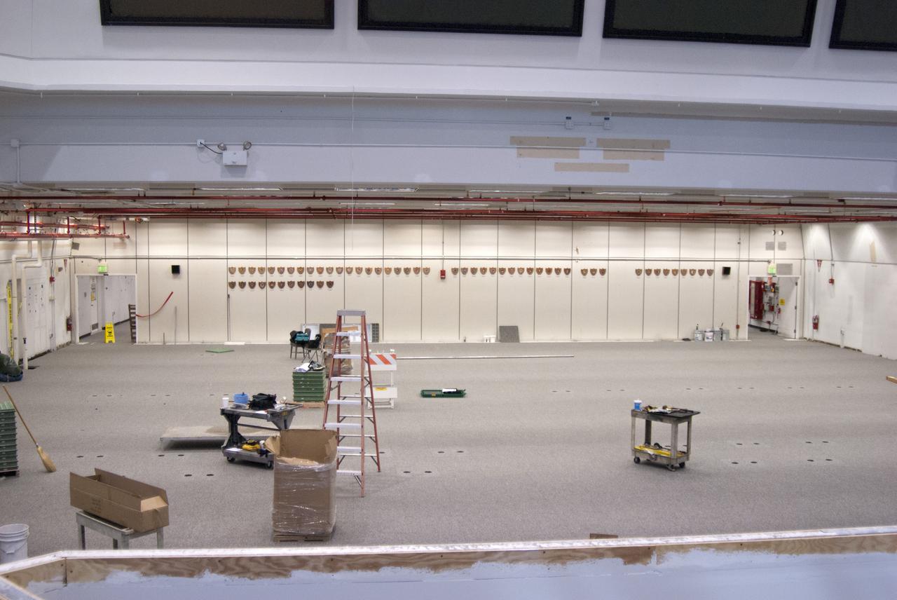 CAPE CANAVERAL, Fla. – At NASA’s Kennedy Space Center in Florida, modifications continue to Firing Room 3 in the Launch Control Center, or LCC. Wiring and conduits below the floor have been upgraded and new flooring is being installed. Firing Rooms inside the LCC are being upgraded by the Ground System Development and Operations Program at Kennedy to support the processing and launch of multiple types of rockets and spacecraft, whether they are government or commercial models. Kennedy’s Launch Complex 39 is transitioning to support multiple users with the Firing Rooms being modified to be more generic in nature for upcoming programs. Photo credit: NASA_Gary Thompson