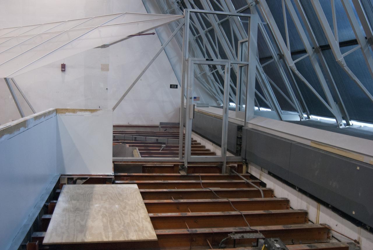 CAPE CANAVERAL, Fla. – At NASA’s Kennedy Space Center in Florida, modifications continue to Firing Room 3 in the Launch Control Center, or LCC. Wiring and conduits below the floor have been upgraded. The legacy flooring leading to and inside a viewing room has been removed and the area is being prepared for new flooring to be installed. Firing Rooms inside the LCC are being upgraded by the Ground System Development and Operations Program at Kennedy to support the processing and launch of multiple types of rockets and spacecraft, whether they are government or commercial models. Kennedy’s Launch Complex 39 is transitioning to support multiple users with the Firing Rooms being modified to be more generic in nature for upcoming programs. Photo credit: NASA_Gary Thompson