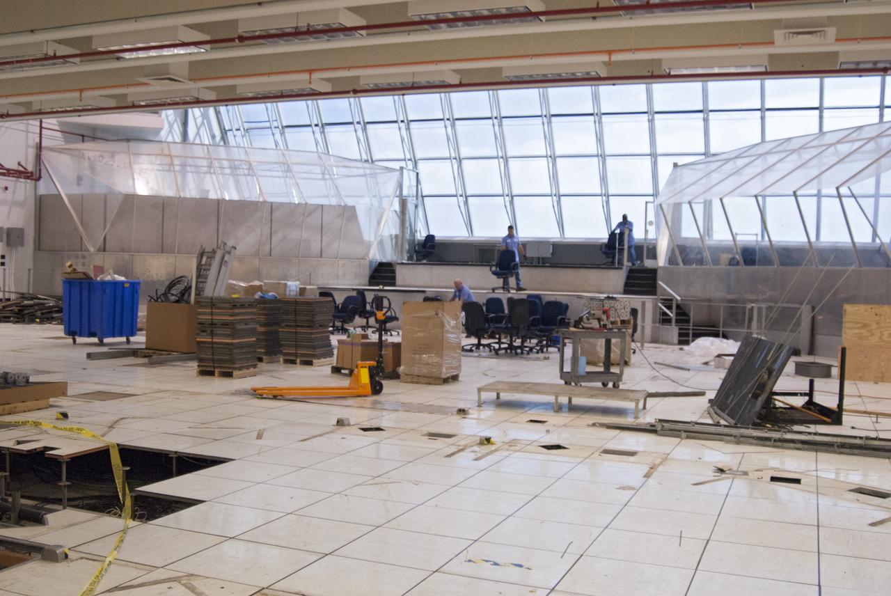 CAPE CANAVERAL, Fla. – At NASA’s Kennedy Space Center in Florida, work continues in Firing Room 2 in the Launch Control Center, or LCC. The legacy flooring is being removed and wiring and conduits below the floor will be upgraded. The mission director’s room to the left and another viewing room to the right also will be upgraded. Firing Rooms inside the LCC are being upgraded by the Ground System Development and Operations Program at Kennedy to support the processing and launch of multiple types of rockets and spacecraft, whether they are government or commercial models. Kennedy’s Launch Complex 39 is transitioning to support multiple users with the Firing Rooms being modified to be more generic in nature for upcoming programs. Photo credit: NASA_Gary Thompson