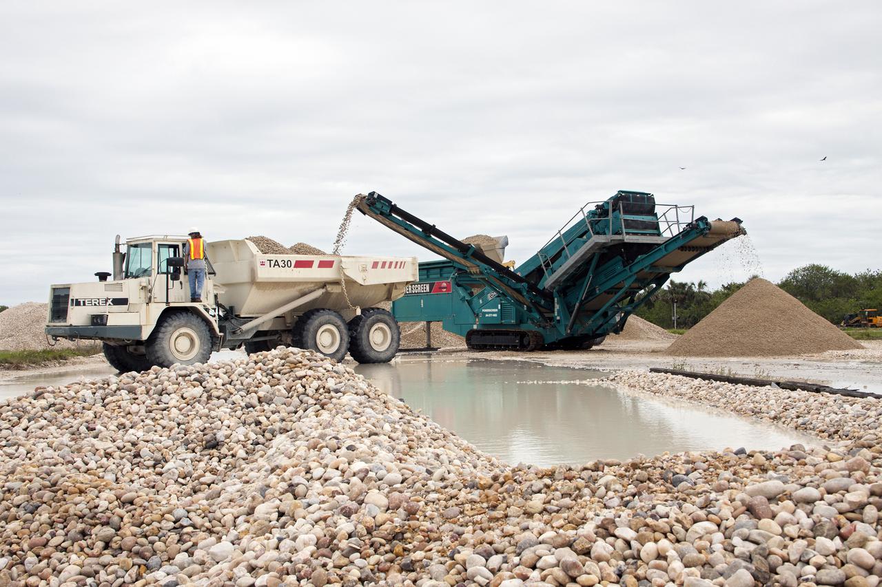 CAPE CANAVERAL, Fla. – At NASA’s Kennedy Space Center in Florida, screening equipment is operating to separate pulverized Alabama river rock from stones still usable in the crawlerway leading from the Vehicle Assembly Building VAB to the launch pads. The rock no longer suitable for the crawlerway will be reused in other areas of the spaceport. After years of wear from the weight of space shuttles being transported to the launch pads, the crawlerway was in need of resurfacing in preparation for future programs. The Ground Systems Development and Operations GSDO Program office at Kennedy is working to upgrade the two 40-foot-wide pathways the crawler-transporter will travel as it transports vehicles such as NASA's Space Launch System SLS rocket from the VAB to the launch pad. For more: http:__www.nasa.gov_exploration_systems_ground_crawlerway_upgrades.html Photo credit: NASA_Jim Grossmann