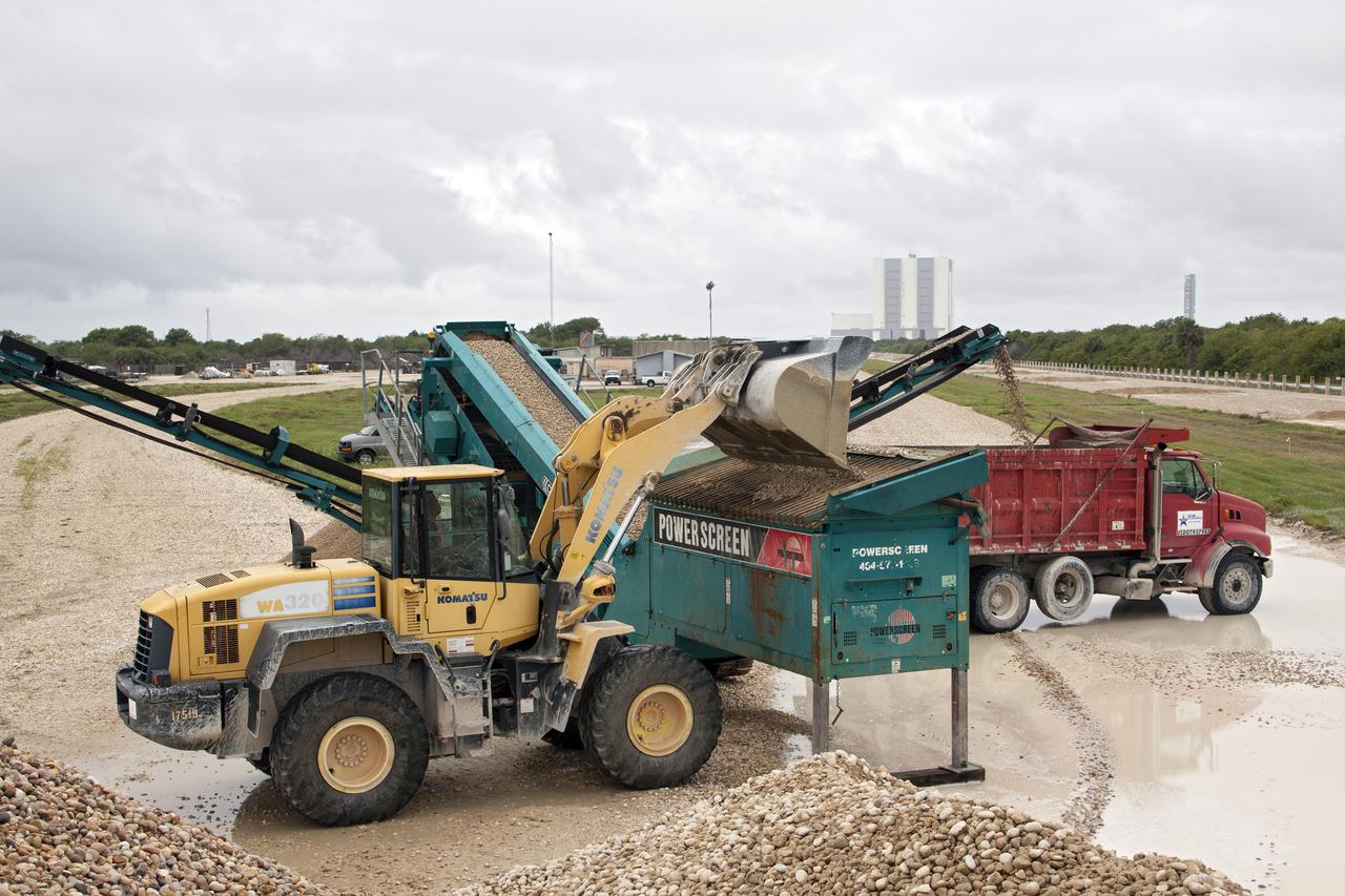 CAPE CANAVERAL, Fla. – At NASA’s Kennedy Space Center in Florida, screening equipment is operating to separate pulverized Alabama river rock from stones still usable in the crawlerway leading from the Vehicle Assembly Building VAB to the launch pads. The rock no longer suitable for the crawlerway will be reused in other areas of the spaceport. After years of wear from the weight of space shuttles being transported to the launch pads, the crawlerway was in need of resurfacing in preparation for future programs. The Ground Systems Development and Operations GSDO Program office at Kennedy is working to upgrade the two 40-foot-wide pathways the crawler-transporter will travel as it transports vehicles such as NASA's Space Launch System SLS rocket from the VAB to the launch pad. For more: http:__www.nasa.gov_exploration_systems_ground_crawlerway_upgrades.html Photo credit: NASA_Jim Grossmann