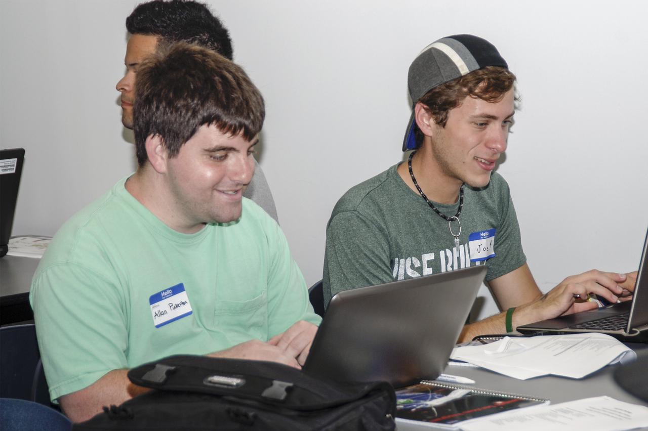 CAPE CANAVERAL, Fla. – Allan Pinkerton, at left, and Joey Vars, students from the University of South Florida at St. Petersburg, brainstorm ideas during the 2013 International Space Apps Challenge at the Center for Space Education at the Kennedy Space Center Visitor Complex in Florida. During the worldwide two-day challenge, more than 9,000 people and 484 organizations came together in 83 cities across 44 countries, as well as online, to develop new ways of solving challenges that NASA faces. At Kennedy, four teams brainstormed ideas with subject matter experts and others and worked nearly 32 hours straight to present their concepts to a panel of three technical and non-technical judges. Challenges tackled at Kennedy were: Deployable Greenhouse, Kennedy Space Center 2040, Seven Minutes of Science, and Moonville – Lunar Industry Game. Photo credit: NASA_Charisse Nahser
