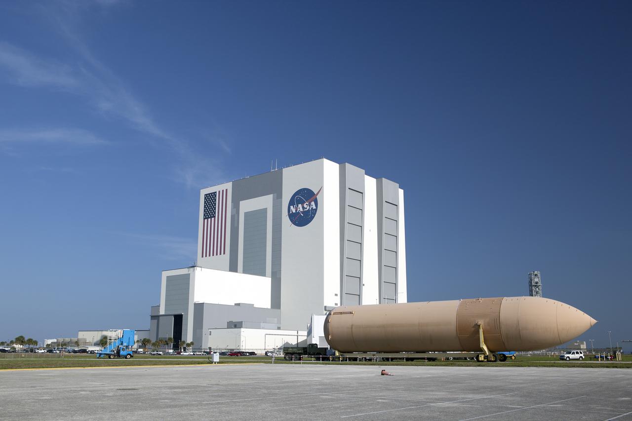 CAPE CANAVERAL, Fla. -- An orange flight test article space shuttle external fuel tank, or ET, awaits transport from NASA's Kennedy Space Center in Florida to the Wings of Dreams Aviation Museum located at Keystone Heights Airport in North Central Florida. Weighing in at 58,000 pounds unfueled and standing more than 15-stories tall, the ET was referred to as the 'backbone' of the space shuttle. Its job was to hold about 535,000 gallons of super-cold liquid hydrogen and liquid oxygen. It also absorbed the thrust loads produced at launch by the orbiter and the solid rocket boosters, or SRBs. Also joining the ET at Wings of Dreams is an ET transporter, the crew transport vehicle, crew hatch access vehicle, SRB aft skirt and SRB frustum.  Thousands of unique space shuttle era artifacts are being allocated to facilities across the country for their new missions to educate and inspire America's next generation of explorers. Photo credit: NASA_Dimitri Gerondidakis