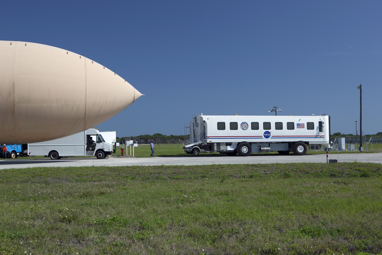 CAPE CANAVERAL, Fla. – An orange flight test article space shuttle external fuel tank, or ET, is prepared to be loaded onto a barge for the first leg of its journey from NASA's Kennedy Space Center in Florida to the Wings of Dreams Aviation Museum located at Keystone Heights Airport in North Central Florida. Weighing in at 58,000 pounds unfueled and standing more than 15-stories tall, the ET was referred to as the 'backbone' of the space shuttle. Its job was to hold about 535,000 gallons of super-cold liquid hydrogen and liquid oxygen. It also absorbed the thrust loads produced at launch by the orbiter and the solid rocket boosters, or SRBs. Also joining the ET at Wings of Dreams is an ET transporter, the crew transport vehicle, crew hatch access vehicle, SRB aft skirt and SRB frustum.  Thousands of unique space shuttle era artifacts are being allocated to facilities across the country for their new missions to educate and inspire America's next generation of explorers. Photo credit: NASA_Dimitri Gerondidakis