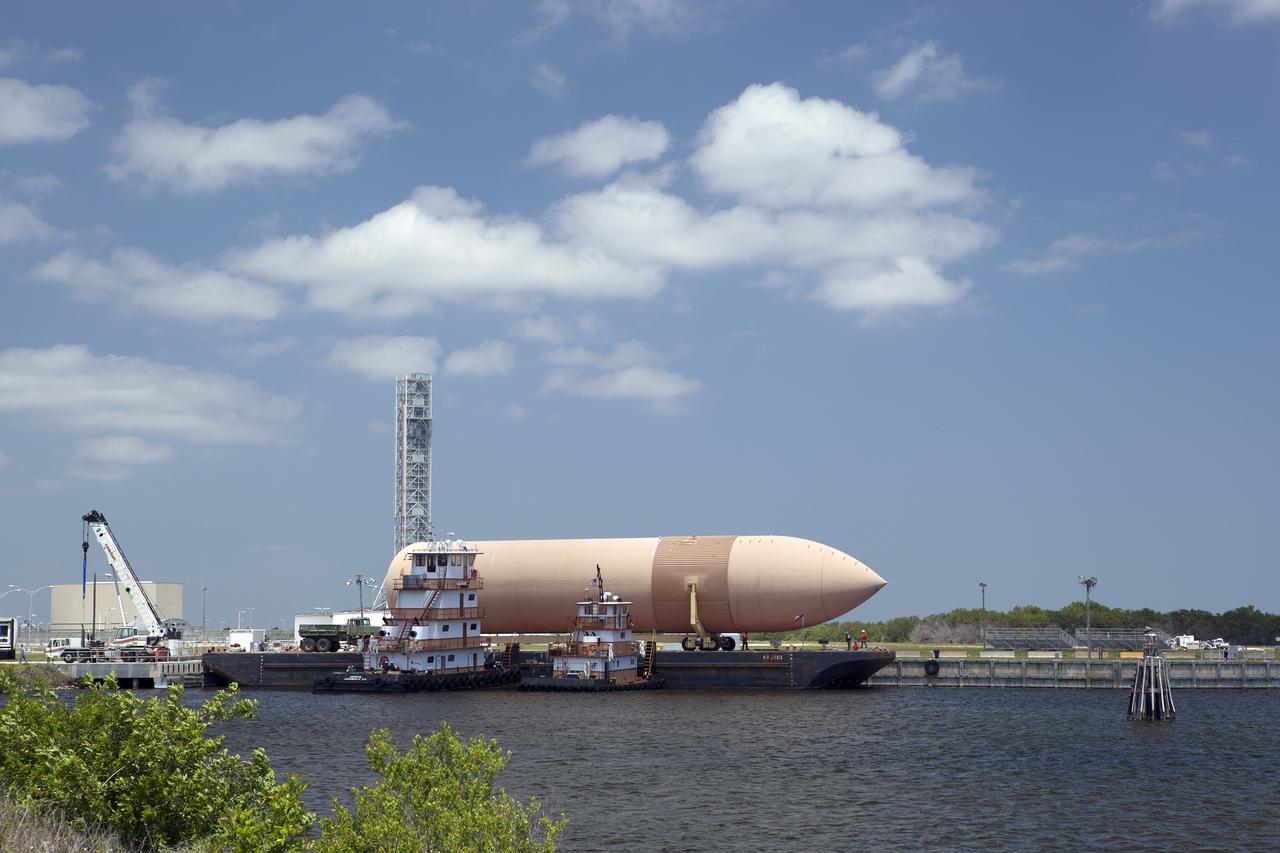 CAPE CANAVERAL, Fla. --The space shuttle crew transport vehicle and crew hatch access vehicle await transport from NASA's Kennedy Space Center in Florida to the Wings of Dreams Aviation Museum located at Keystone Heights Airport in North Central Florida. Also joining the vehicles at Wings of Dreams is an orange flight test article external fuel tank, or ET, an ET transporter, solid rocket booster, or SRB, aft skirt and SRB frustum.  Thousands of unique space shuttle era artifacts are being allocated to facilities across the country for their new missions to educate and inspire America's next generation of explorers. Photo credit: NASA_Dimitri Gerondidakis