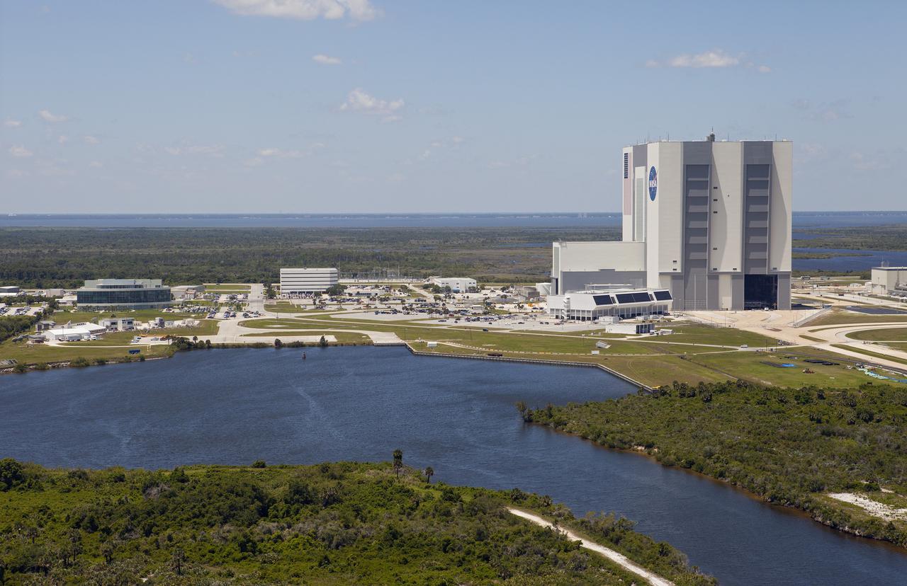 CAPE CANAVERAL, Fla. – An up close aerial view of the Vehicle Assembly Building and other facilities in the Launch Complex 39 area at NASA’s Kennedy Space Center in Florida. In front of the VAB is the Launch Control Center. To the left are the Operations Support Buildings I and II.    Upgrades are underway at Pad B and other facilities in the Launch Complex 39 area. The Ground Systems Development and Operations, or GSDO, Program office at Kennedy is leading the center’s transformation from a historically government-only launch complex to a spaceport that can safely handle a variety of rockets and spacecraft, including NASA’s Space Launch System. For more information about GSDO, visit: http:__go.nasa.gov_groundsystems.  Photo credit: NASA_Kim Shiflett