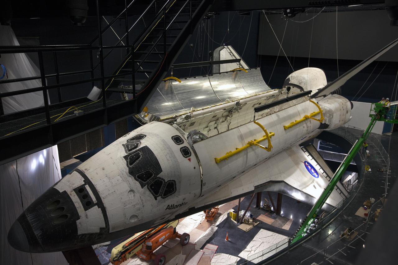 CAPE CANAVERAL, Fla. – At the Kennedy Space Center Visitor Complex in Florida, one of space shuttle Atlantis’ payload bay doors has been opened. Atlantis is being prepared for display in the “Space Shuttle Atlantis” exhibit, a 90,000-square-foot facility, scheduled to open June 29, 2013.  The new $100 million facility will include interactive exhibits that tell the story of the 30-year Space Shuttle Program and highlight the future of space exploration. Visitors to the exhibit will get an up close look at Atlantis with its payload bay doors open, similar to how it looked in space. Photo credit: NASA_Kim Shiflett