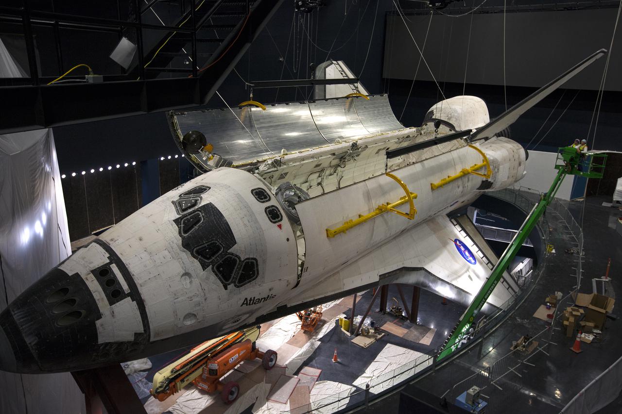 CAPE CANAVERAL, Fla. – At the Kennedy Space Center Visitor Complex in Florida, one of space shuttle Atlantis’ payload bay doors has been opened. Atlantis is being prepared for display in the “Space Shuttle Atlantis” exhibit, a 90,000-square-foot facility, scheduled to open June 29, 2013.  The new $100 million facility will include interactive exhibits that tell the story of the 30-year Space Shuttle Program and highlight the future of space exploration. Visitors to the exhibit will get an up close look at Atlantis with its payload bay doors open, similar to how it looked in space. Photo credit: NASA_Kim Shiflett