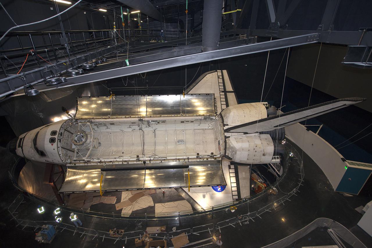 CAPE CANAVERAL, Fla. – At the Kennedy Space Center Visitor Complex in Florida, space shuttle Atlantis’ payload bay doors have been opened, revealing the payload bay. Atlantis is being prepared for display in the “Space Shuttle Atlantis” exhibit, a 90,000-square-foot facility, scheduled to open June 29, 2013.  The new $100 million facility will include interactive exhibits that tell the story of the 30-year Space Shuttle Program and highlight the future of space exploration. Visitors to the exhibit will get an up close look at Atlantis with its payload bay doors open, similar to how it looked in space. Photo credit: NASA_Kim Shiflett