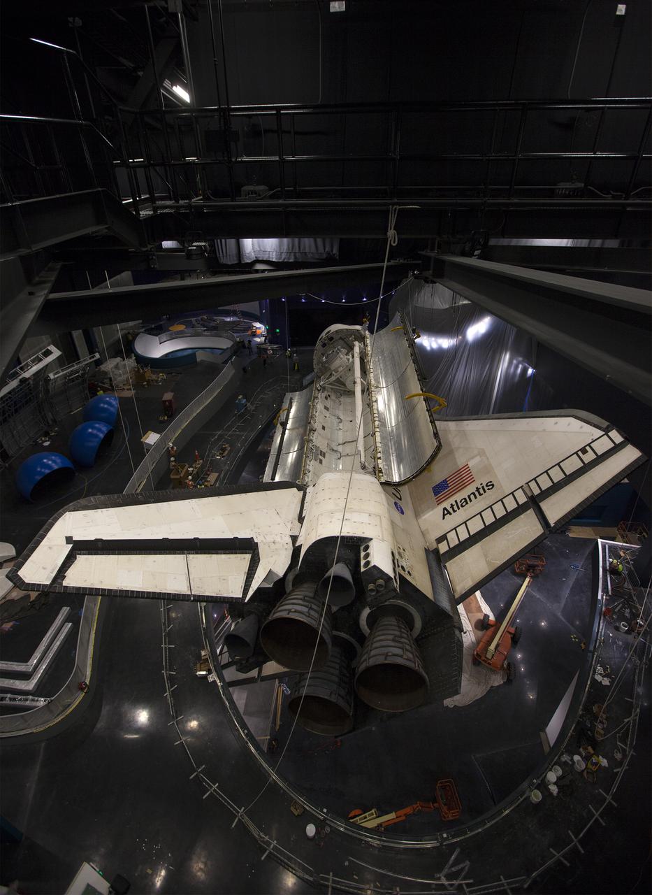 CAPE CANAVERAL, Fla. – At the Kennedy Space Center Visitor Complex in Florida, a view from a different angle shows space shuttle Atlantis’ with its payload bay doors opened. Also in view are the shuttle’s tail mast and three replica shuttle main engines. Atlantis is being prepared for display in the “Space Shuttle Atlantis” exhibit, a 90,000-square-foot facility, scheduled to open June 29, 2013.  The new $100 million facility will include interactive exhibits that tell the story of the 30-year Space Shuttle Program and highlight the future of space exploration. Visitors to the exhibit will get an up close look at Atlantis with its payload bay doors open, similar to how it looked in space. Photo credit: NASA_Kim Shiflett