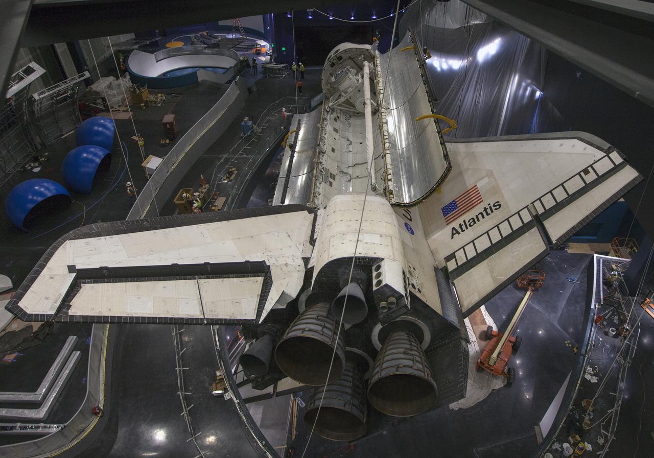 CAPE CANAVERAL, Fla. – At the Kennedy Space Center Visitor Complex in Florida, a view from a different angle shows space shuttle Atlantis’ with its payload bay doors opened. Also in view are the shuttle’s tail mast and three replica shuttle main engines. Atlantis is being prepared for display in the “Space Shuttle Atlantis” exhibit, a 90,000-square-foot facility, scheduled to open June 29, 2013.  The new $100 million facility will include interactive exhibits that tell the story of the 30-year Space Shuttle Program and highlight the future of space exploration. Visitors to the exhibit will get an up close look at Atlantis with its payload bay doors open, similar to how it looked in space. Photo credit: NASA_Kim Shiflett