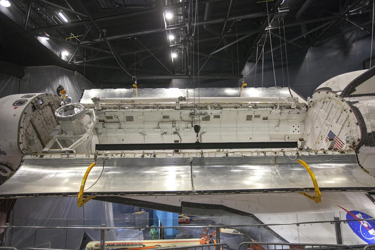 CAPE CANAVERAL, Fla. – At the Kennedy Space Center Visitor Complex in Florida, a close-up view shows space shuttle Atlantis’ payload bay doors have been opened, revealing the payload bay. Atlantis is being prepared for display in the “Space Shuttle Atlantis” exhibit, a 90,000-square-foot facility, scheduled to open June 29, 2013.  The new $100 million facility will include interactive exhibits that tell the story of the 30-year Space Shuttle Program and highlight the future of space exploration. Visitors to the exhibit will get an up close look at Atlantis with its payload bay doors open, similar to how it looked in space. Photo credit: NASA_Kim Shiflett