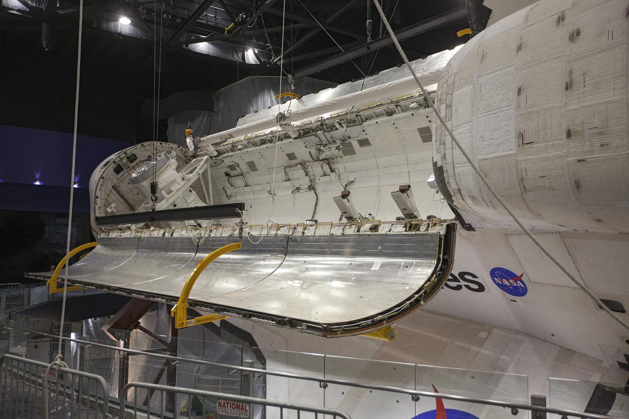 CAPE CANAVERAL, Fla. – At the Kennedy Space Center Visitor Complex in Florida, a close-up view shows space shuttle Atlantis’ payload bay doors have been opened, revealing the payload bay. Atlantis is being prepared for display in the “Space Shuttle Atlantis” exhibit, a 90,000-square-foot facility, scheduled to open June 29, 2013.  The new $100 million facility will include interactive exhibits that tell the story of the 30-year Space Shuttle Program and highlight the future of space exploration. Visitors to the exhibit will get an up close look at Atlantis with its payload bay doors open, similar to how it looked in space. Photo credit: NASA_Kim Shiflett