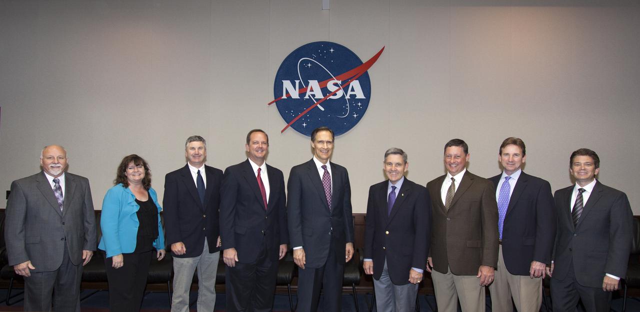 CAPE CANAVERAL, Fla. -- Kennedy Space Center Director Bob Cabana, met with representatives of PaR Systems Inc. NASA recently established a partnership agreement with PaR to operate of the Hangar N facility and its nondestructive testing equipment. Participating were, from the left, Cliff Hausmann, Technical Integration manager in NASA's Program Control and Integration Office, Amy Houts-Gilfriche, Partnership Development manager in NASA's Center Planning and Development Directorate, Scott Colloredo of NASA's Systems Engineering and Integration Division, Tom Engler, deputy director of Center Planning and Development, Brian Behm, president of the Robotics Division of PaR Systems, Tony Corak, manager, of Non-destructive Testing Services for PaR Systems, Dale Ketcham of Space Florida, and Robert Salonen, director of Business Development for the Economic Development Commission of Florida's Space Coast.   As the spaceport transitions from a historically government-only launch facility to a multiuser spaceport for both federal and commercial customers, partnerships with other organizations will be a key element in that effort. Hangar N is located at Cape Canaveral Air Force Station adjacent to Kennedy. The facility's unique inventory of nondestructive test and evaluation NDE equipment and the capability for current and future mission spaceflight support was an asset NASA wanted to retain. Photo credit: NASA_Jim Grossmann