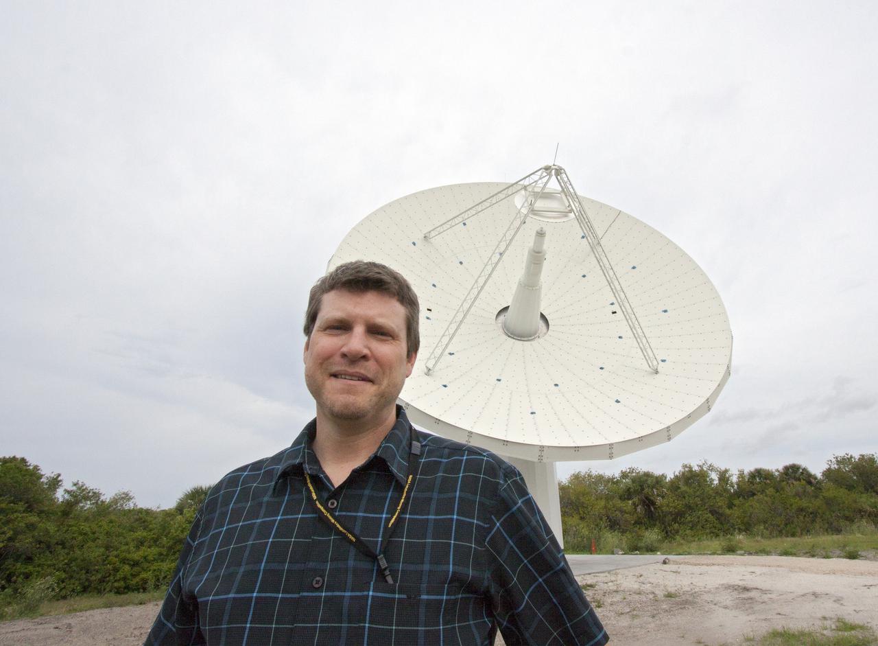 CAPE CANAVERAL, Fla. – At NASA’s Kennedy Space Center in Florida, Marc Seibert, the manager for Tracking and Timing Integration in the Research and Technology Management Office, stands near one of the three antennas that comprise the KA-Band Objects Observation and Monitoring, or Ka-BOOM, System.  The Ka-BOOM project is one of the final steps in developing the techniques to build a high power, high resolution radar system capable of becoming a Near Earth Object Early Warning System. While also capable of space communication and radio science experiments, developing radar applications is the primary focus of the arrays. The 40-foot-diameter dish antenna arrays are near the former Vertical Processing Facility, which has been demolished. Photo credit: NASA_Jim Grossmann