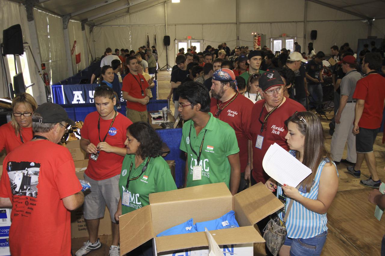 CAPE CANAVERAL, Fla. – At NASA’s Kennedy Space Center Visitor Complex in Florida, college students arrive for NASA’s Fourth Annual Robotic Mining Competition, held May 20-24.  The mining competition is coordinated by Kennedy Space Center’s Education Office for the agency’s Exploration Systems Mission Directorate. Undergraduate and graduate students from 50 universities and colleges in the U.S. and around the world use their remote-controlled robots to maneuver and dig in a supersized sandbox filled with a crushed material called regolith that has characteristics similar to asteroids, moons of Mars and Mars itself. Photo credit: NASA_Jim Grossman