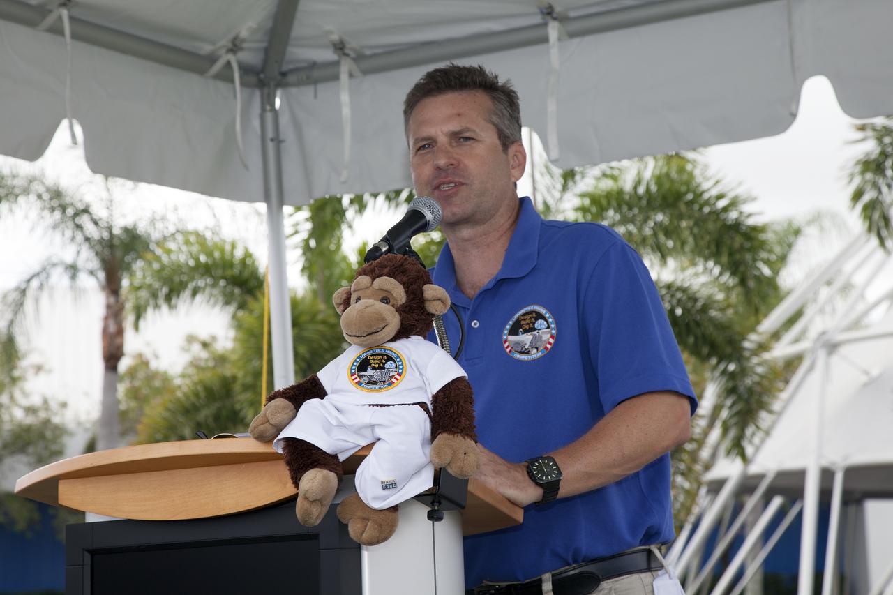 CAPE CANAVERAL, Fla. – At NASA’s Kennedy Space Center Visitor Complex in Florida, Rob Mueller, lead technical expert and head judge welcomes college students to NASA’s Fourth Annual Robotic Mining Competition during the opening ceremony. The competition will take place through May 24.  The mining competition is coordinated by Kennedy Space Center’s Education Office for the agency’s Exploration Systems Mission Directorate. Undergraduate and graduate students from 50 universities and colleges in the U.S. and eight countries around the world will use their remote-controlled robots to maneuver and dig in a supersized sandbox filled with a crushed material called regolith that has characteristics similar to asteroids, moons of Mars and Mars itself. Photo credit: NASA_Lorne Mathre
