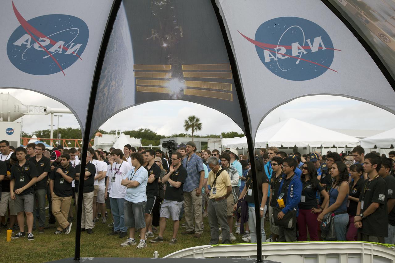 CAPE CANAVERAL, Fla. – At NASA’s Kennedy Space Center Visitor Complex in Florida, students from the United States and around the country gather together for the opening ceremony of NASA’s Fourth Annual Robotic Mining Competition. The competition will take place through May 24.  The mining competition is coordinated by Kennedy Space Center’s Education Office for the agency’s Exploration Systems Mission Directorate. Undergraduate and graduate students from 50 universities and colleges in the U.S. and eight countries around the world will use their remote-controlled robots to maneuver and dig in a supersized sandbox filled with a crushed material called regolith that has characteristics similar to asteroids, moons of Mars and Mars itself. Photo credit: NASA_Lorne Mathre