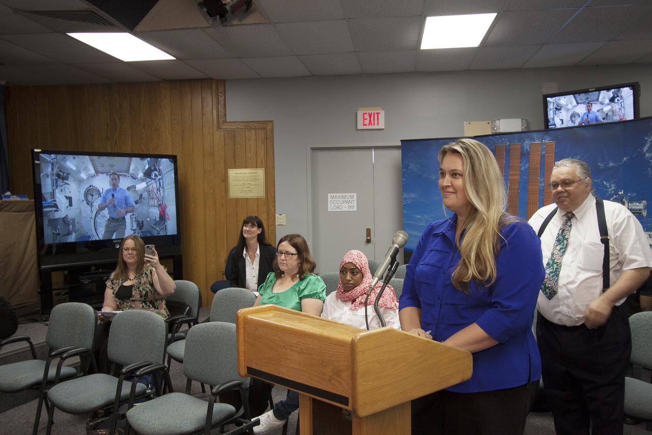 CAPE CANAVERAL, Fla. – Monica DeFelice, one of nine Florida Institute of Technology aspiring journalists visiting Kennedy Space Center in Florida on May 22, interviews astronaut and Expedition 35 flight engineer Chris Cassidy during an International Space Station downlink in the Press Site auditorium. The journalists, in collaboration with Florida Today, are working on a multimedia project that examines health in zero gravity and how life in space can help people live better on Earth. These multimedia stories will be published for the print and online versions of Florida Today. During their visit, they worked on multimedia deadline news assignments at the Press Site. They also met with Kennedy Director Bob Cabana who talked about NASA's goals for the future and his own experience in space, answering questions about health effects of spaceflight. The journalists toured the Vehicle Assembly Building and the Apollo Saturn V Center. Learn about the Florida Institute of Technology journalists' findings on their Facebook page at http:__www.facebook.com_FT3atFIT or Twitter at #SpaceHealth. Photo credit: NASA_Jim Grossmann
