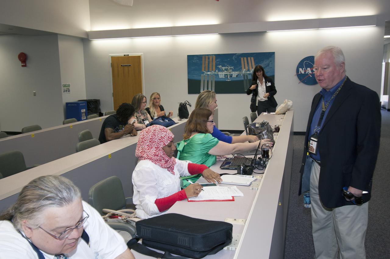 CAPE CANAVERAL, Fla. – Florida Today reporter Todd Halvorson, shares his expertise and experiences with nine Florida Institute of Technology aspiring journalists visiting Kennedy Space Center in Florida on May 22 at the Press Site. The group of students, in collaboration with Florida Today, is working on a multimedia project that examines health in zero gravity and how life in space can help people live better on Earth. These multimedia stories will be published for the print and online versions of Florida Today. During their visit, the students interviewed astronaut and Expedition 35 flight engineer Chris Cassidy during an International Space Station downlink in the Press Site auditorium. The journalists also worked on multimedia deadline news assignments at the Press Site. They also met with Kennedy Director Bob Cabana who talked about NASA's goals for the future and his own experience in space, answering questions about health effects of spaceflight. The journalists toured the Vehicle Assembly Building and the Apollo Saturn V Center. Learn about the Florida Institute of Technology journalists' findings on their Facebook page at http:__www.facebook.com_FT3atFIT or Twitter at #SpaceHealth. Photo credit: NASA_Jim Grossmann