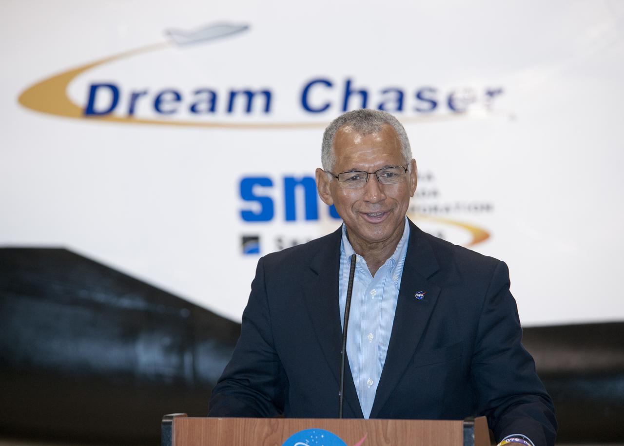 Edwards, Calif. – ED-0155-20 - NASA Administrator Charlie Bolden talks to the media about the importance of the agency's Commercial Crew Program, or CCP, and the development work Sierra Nevada Corporation, or SNC, will perform with its Dream Chaser flight test vehicle at the agency's Dryden Flight Research Center in the coming months.  SNC is one of three companies working with CCP during the agency's Commercial Crew Integrated Capability, or CCiCap, initiative, which is intended to lead to the availability of commercial human spaceflight services for government and commercial customers. To learn more about CCP and its industry partners, visit www.nasa.gov_commercialcrew.   Image credit: NASA_Ken Ulbrich