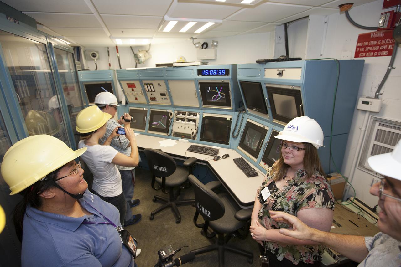 CAPE CANAVERAL, Fla. – A group of nine Florida Institute of Technology aspiring journalists observe the interior of the mobile launcher inside the Vehicle Assembly Building, or VAB, at NASA's Kennedy Space Center in Florida on May 22. The group of students, in collaboration with Florida Today, is working on a multimedia project that examines health in zero gravity and how life in space can help people live better on Earth. These multimedia stories will be published for the print and online versions of Florida Today. At left is Florida Today videographer Caroline Perez. During their visit, the students interviewed astronaut and Expedition 35 flight engineer Chris Cassidy during an International Space Station downlink in the Press Site auditorium. The journalists also met with Kennedy Director Bob Cabana who talked about NASA's goals for the future and his own experience in space, answering questions about health effects of spaceflight. The journalists also toured the Apollo Saturn V Center. Learn about the Florida Institute of Technology journalists' findings on their Facebook page at http:__www.facebook.com_FT3atFIT or Twitter at #SpaceHealth. Photo credit: Photo credit: NASA_Kim Shiflett
