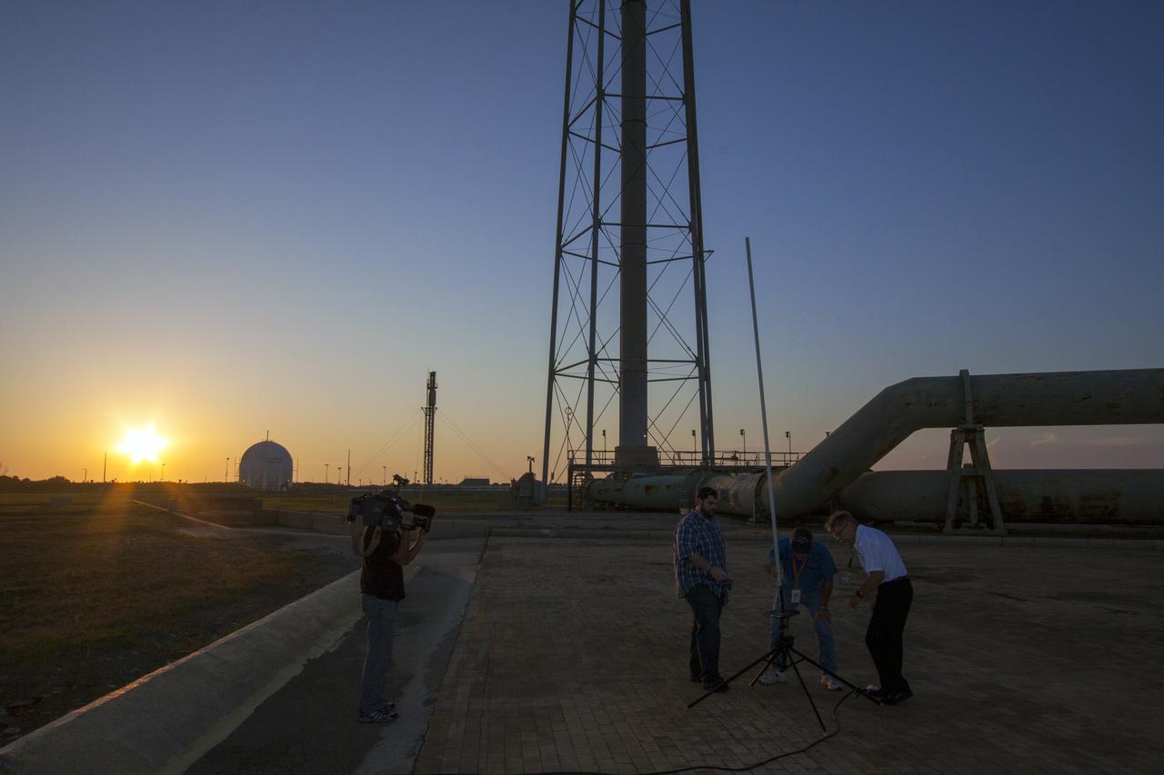 CAPE CANAVERAL, Fla. -- As the sun rises at NASA's Kennedy Space Center's Launch Pad 39A in Florida, a team of NASA engineers prepare to launch a single stage rocket as part of Rocket University. The goal was to test its systems and to verify that it performed as designed. As part of Rocket University, the engineers are given an opportunity to work a fast-track project to develop skills in developing spacecraft systems of the future. As NASA plans for future spaceflight programs to low-Earth orbit and beyond, teams of engineers at Kennedy are gaining experience in designing and flying launch vehicle systems on a small scale. Four teams of five to eight members from Kennedy are designing rockets complete with avionics and recovery systems. Launch operations require coordination with federal agencies, just as they would with rockets launched in support of a NASA mission. Photo credit: NASA_Jim Grossmann